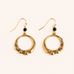gold hoop earrings with black stone on white background