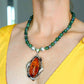Cognac amber statement necklace with green Canadian jade, moss agate beads, and sterling silver pendant