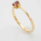 Genuine 14k gold ring with garnet and diamonds in prong setting.