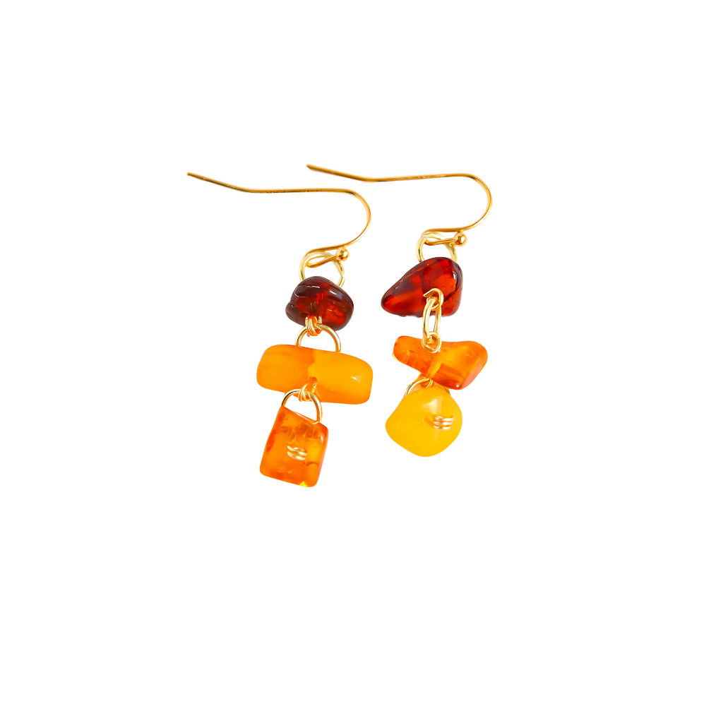 Handmade Baltic amber dangle earrings with cherry, cognac, and butterscotch stones on gold-plated brass wire.