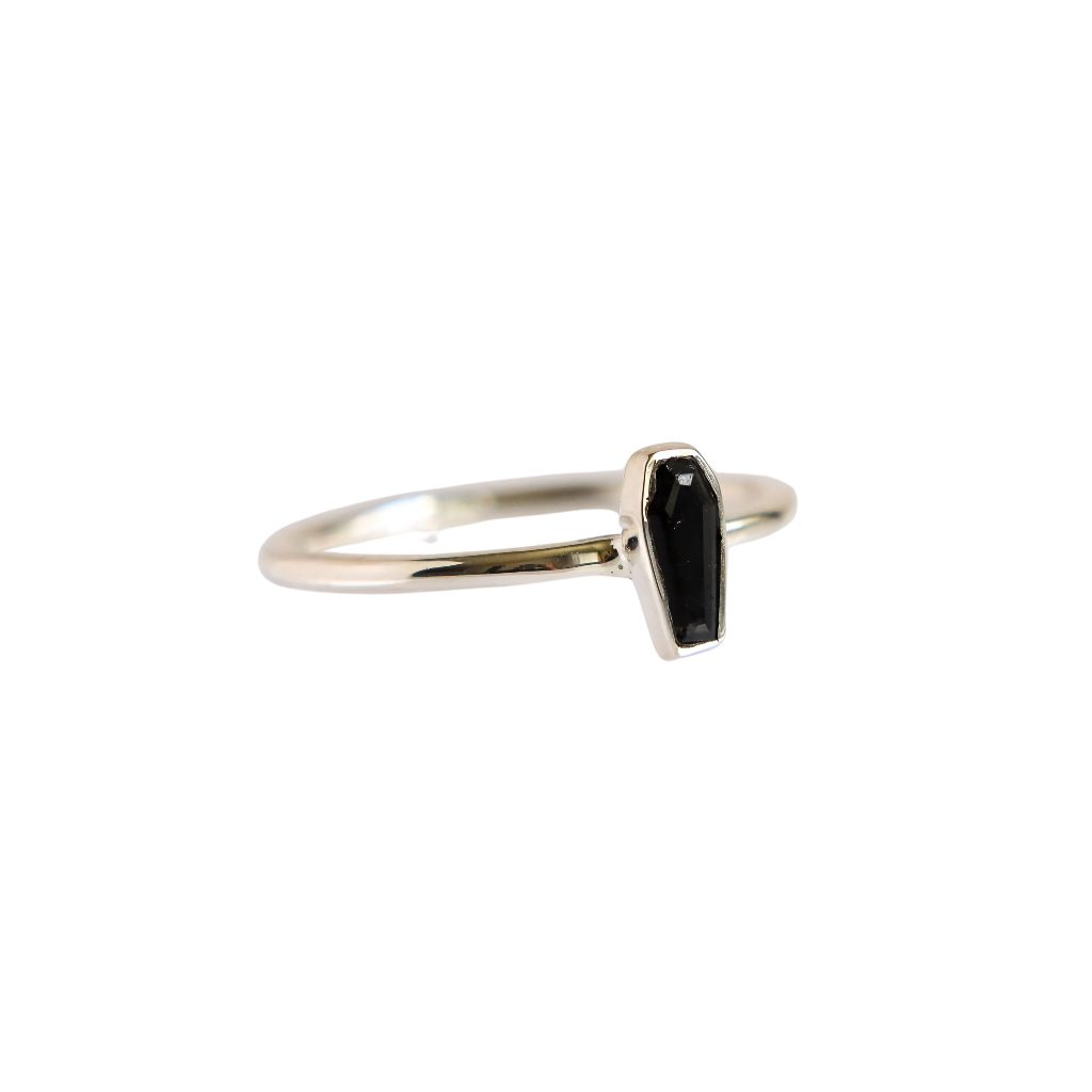 Side angle of black tourmaline coffin goth ring in sterling silver, showing band thickness and gemstone setting detail.