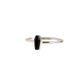 Side angle of black tourmaline coffin goth ring in sterling silver, showing band thickness and gemstone setting detail.