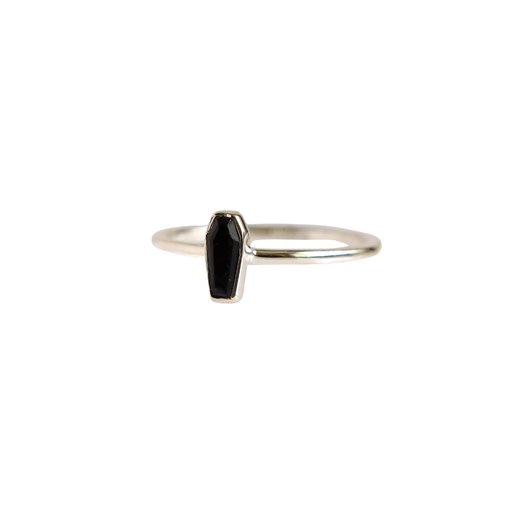 Side angle of black tourmaline coffin goth ring in sterling silver, showing band thickness and gemstone setting detail.