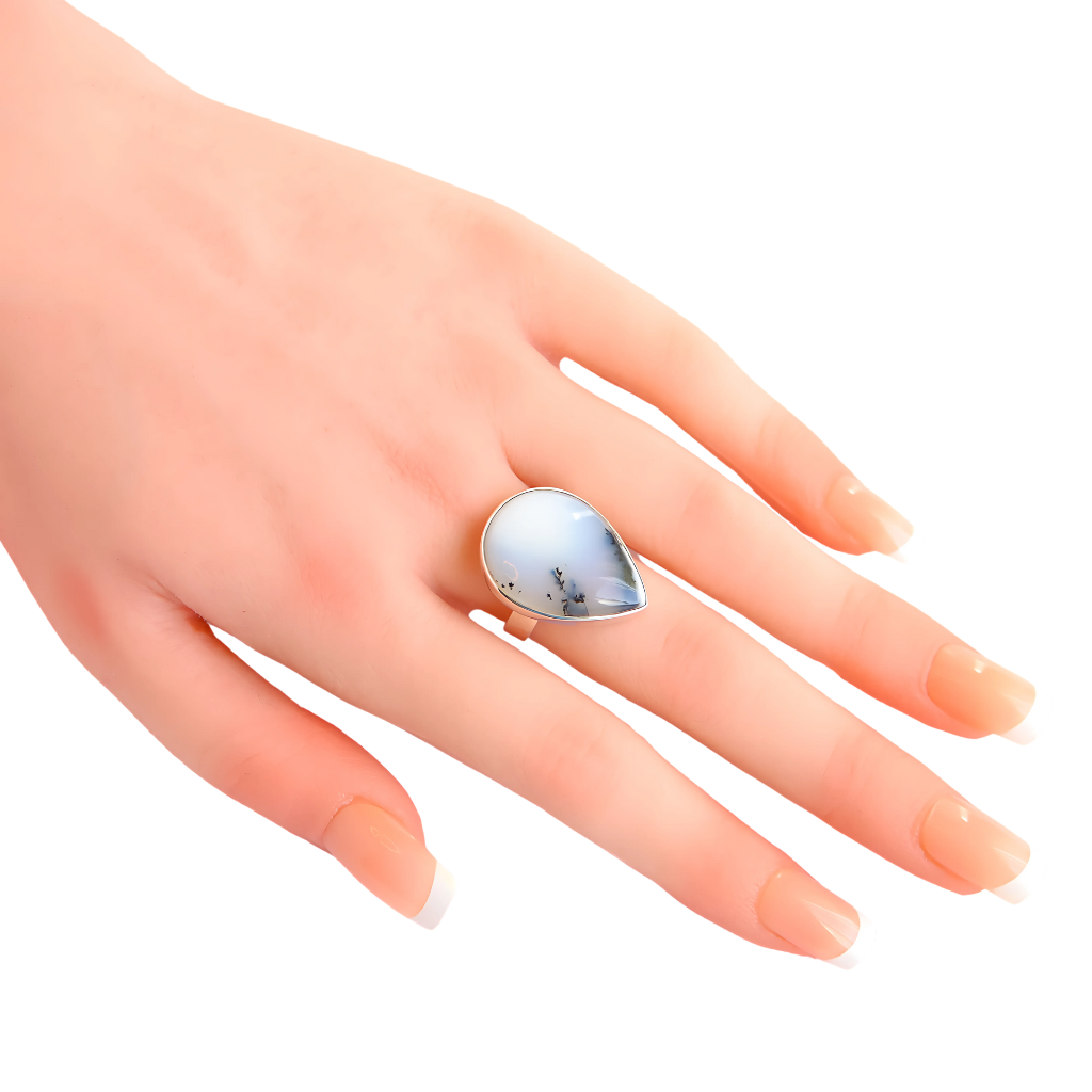 Genuine Dendritic Opal Ring in pear cut set in 925 sterling silver on a hand.