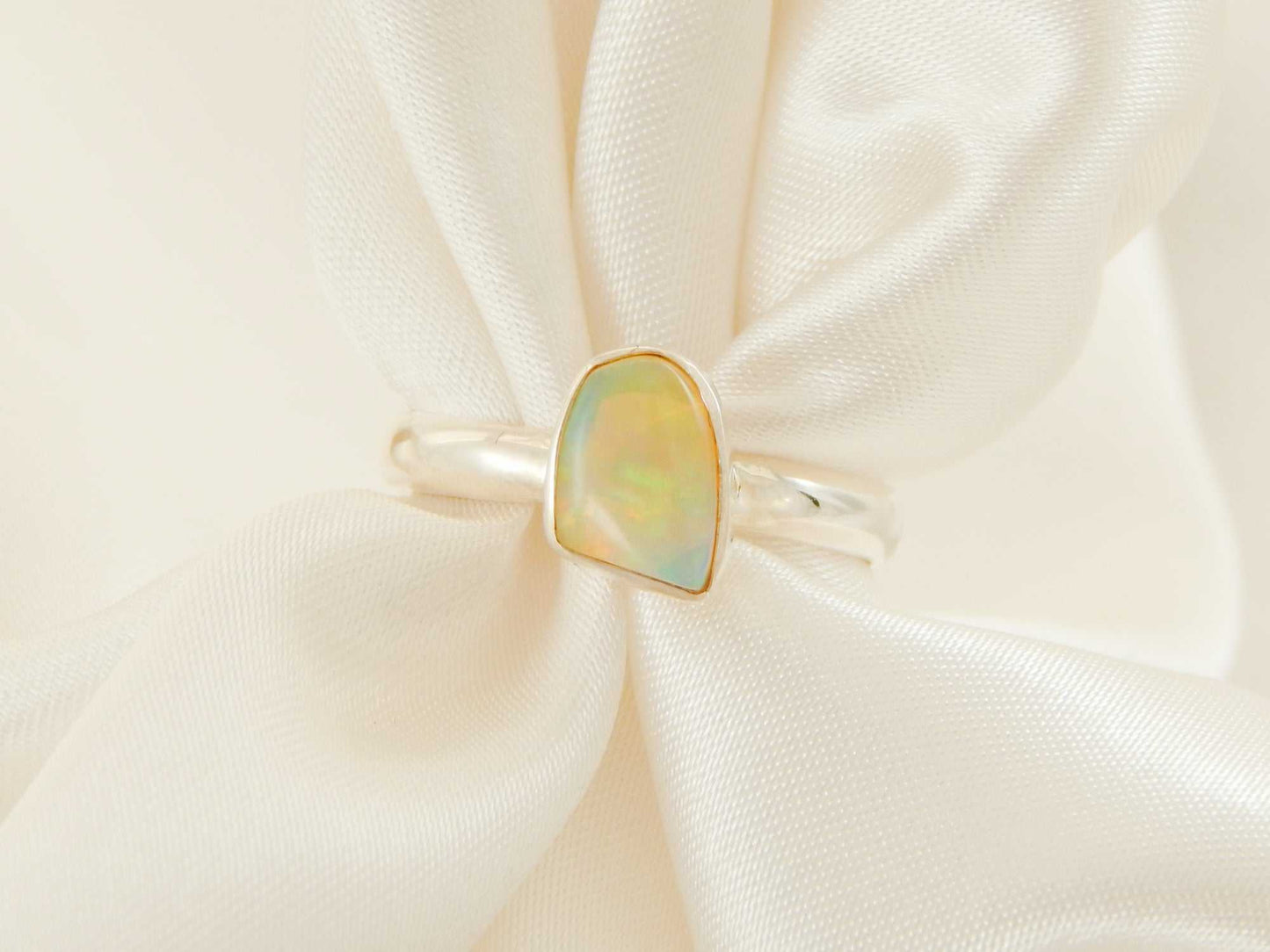 Genuine Ethiopian opal ring in 925 sterling silver with asymmetrical cut.