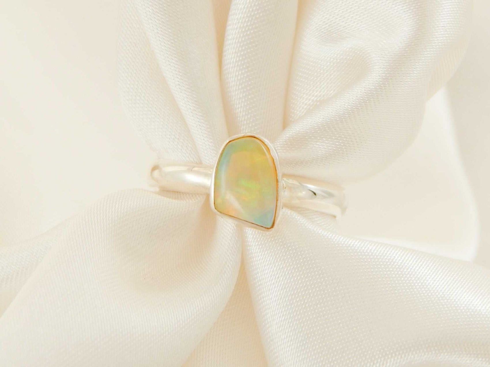 Genuine Ethiopian opal ring in 925 sterling silver with asymmetrical cut.