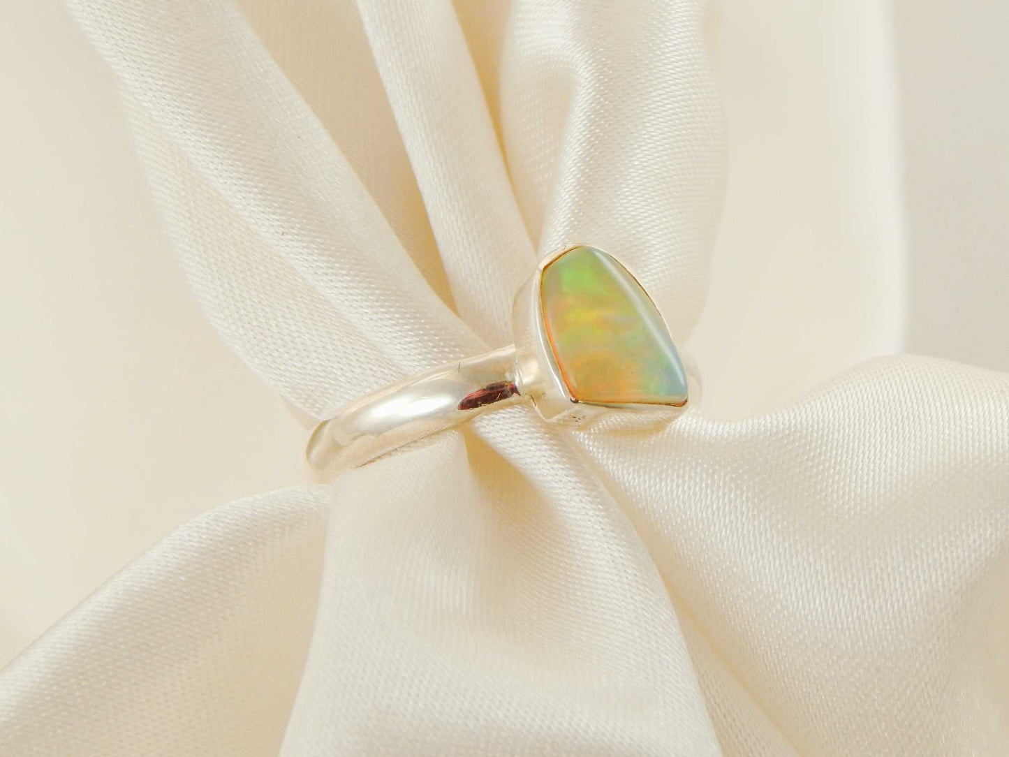 Genuine Ethiopian Opal Ring in 925 Sterling Silver with vivid color play.