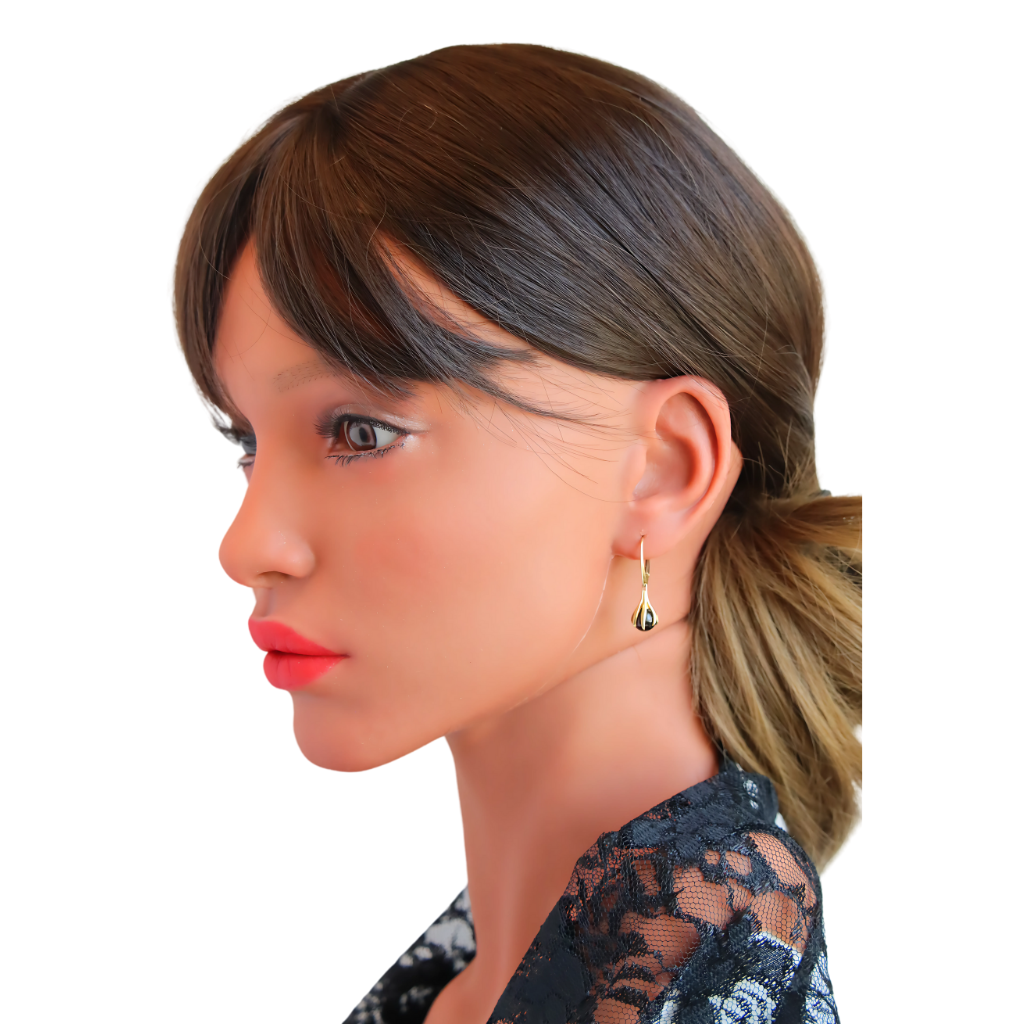 Gold Amber Earrings Baltic amber claw dangle earrings in 14k gold-plated S925, worn by a model.