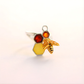 amber Ring with honeycomb, bee, and amber stone on a white background
