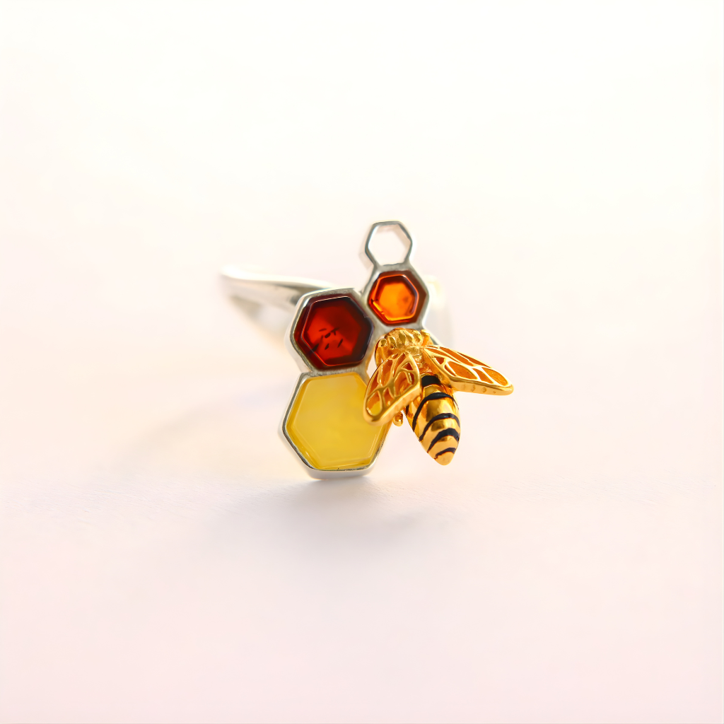 amber Ring with honeycomb, bee, and amber stone on a white background