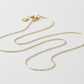dainty cable chain necklace on neutral white background