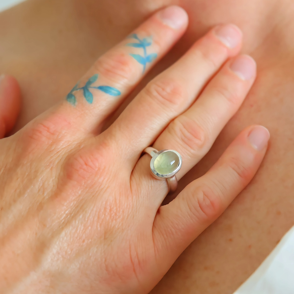 Green amethyst ring on hand