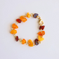 Handmade Baltic amber bracelet with butterscotch, cherry, and cognac stones on gold wire.