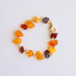 Handmade Baltic amber bracelet with butterscotch, cherry, and cognac stones on gold wire.