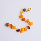 Handmade Baltic amber bracelet with butterscotch, cherry, and cognac stones on gold colored wire.