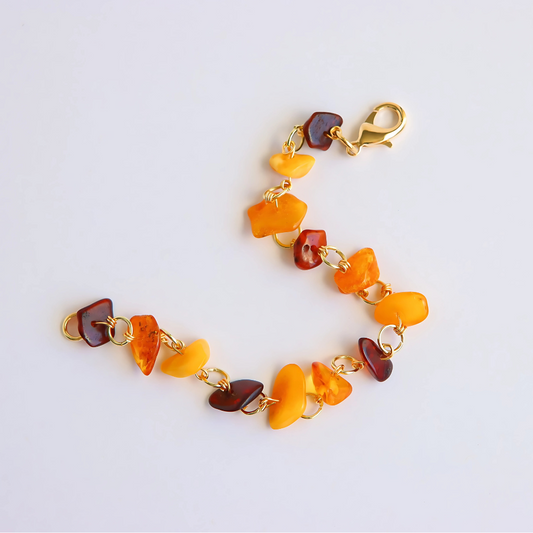 Handmade Baltic amber bracelet with butterscotch, cherry, and cognac stones on gold colored wire.