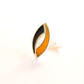 Amber ring with black and orange design on a white background