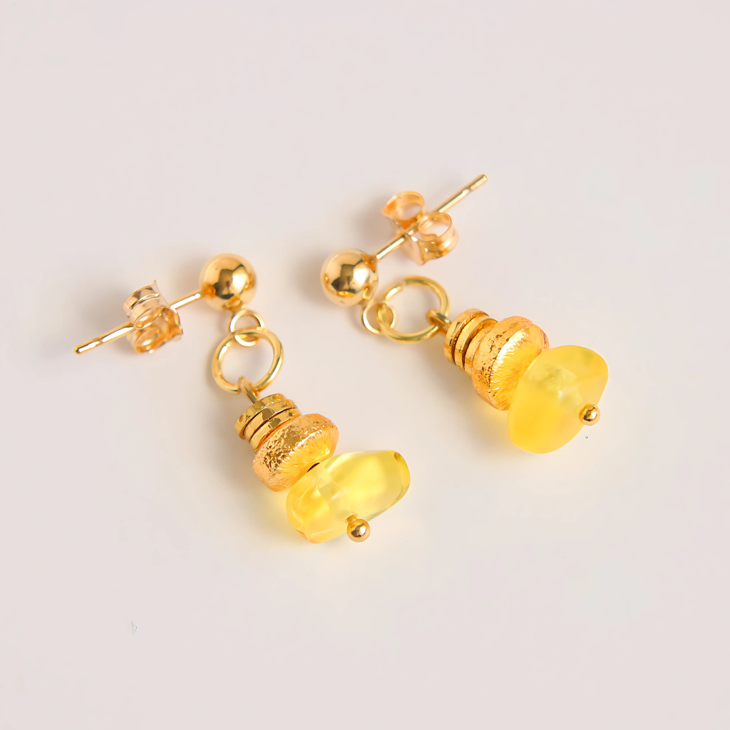 Handmade Baltic amber and gold earrings by artist Alexis Cintron.