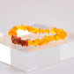 Baltic Honey Amber and Gold Gemstone Bracelet on display. baltic amber bracelet