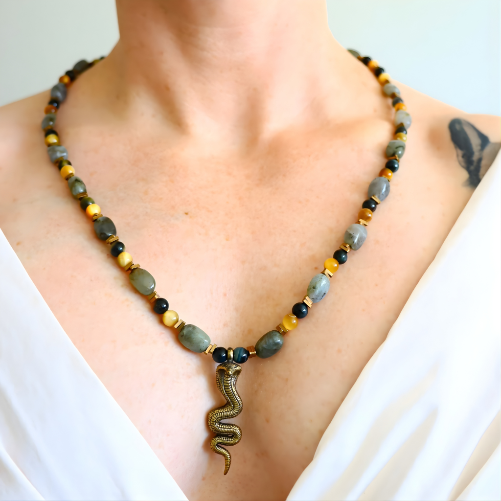 beaded Necklace with a snake pendant worn by a person on a white background