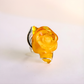 Rose Ring with a yellow rose-shaped design on a white background