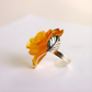 Rose Ring with yellow floral design and silver leaf on a light background