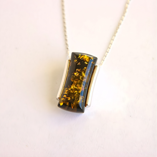 green Amber pendant necklace on a white background