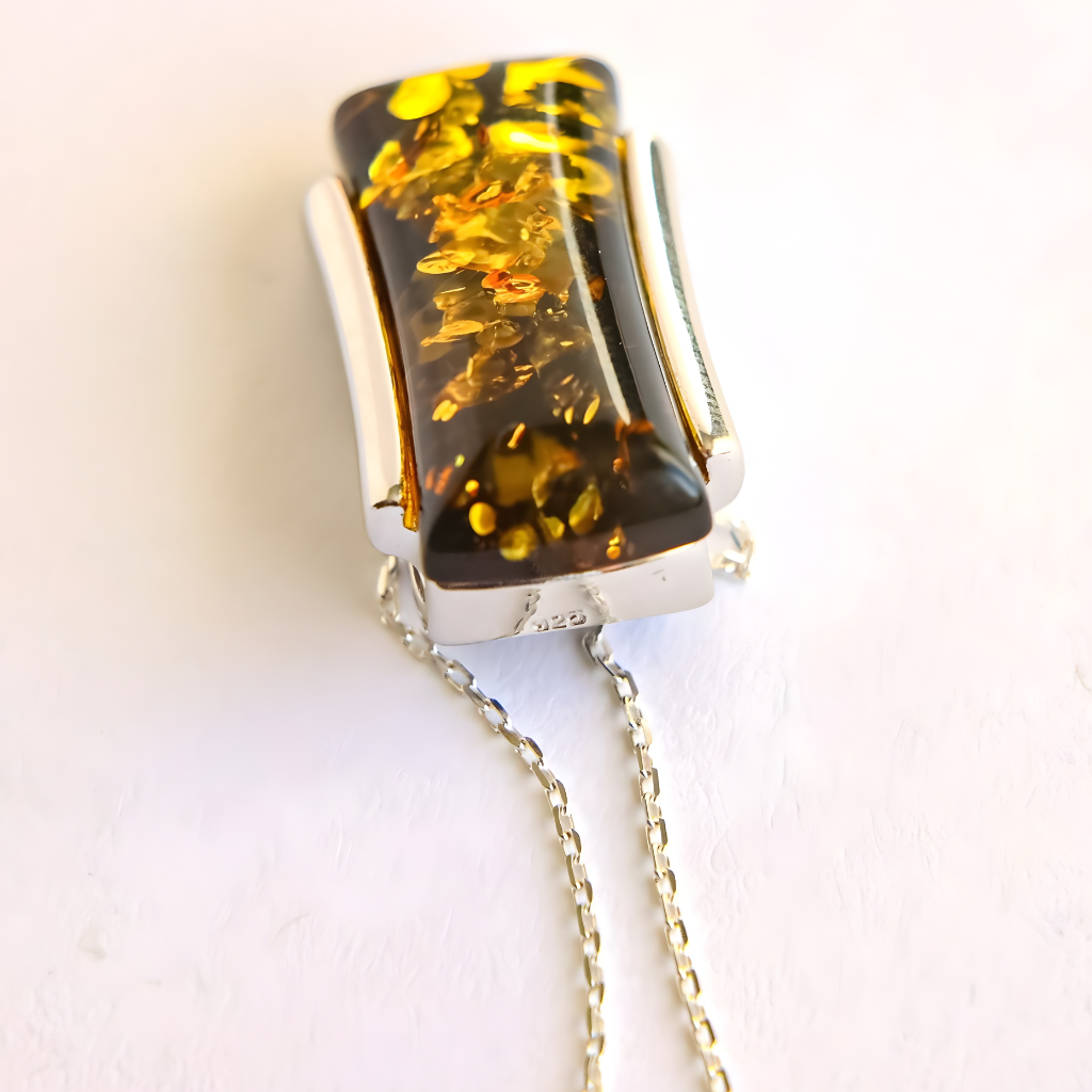 green Amber pendant necklace on a white background