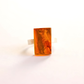 Amber Ring with a large amber stone on a white background