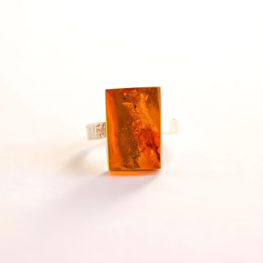 Amber Ring with a large amber stone on a white background
