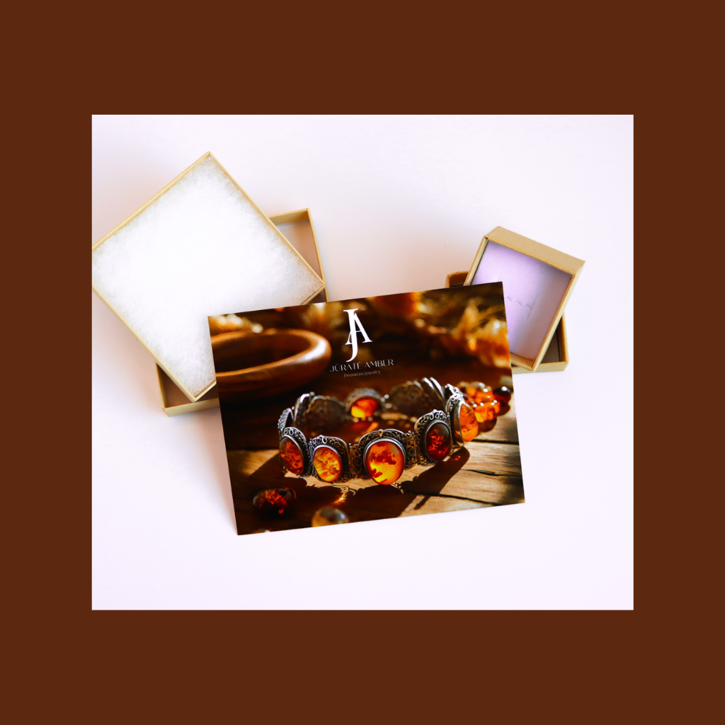 Mosaic Baltic cognac amber earrings in 925 sterling silver on display with packaging.