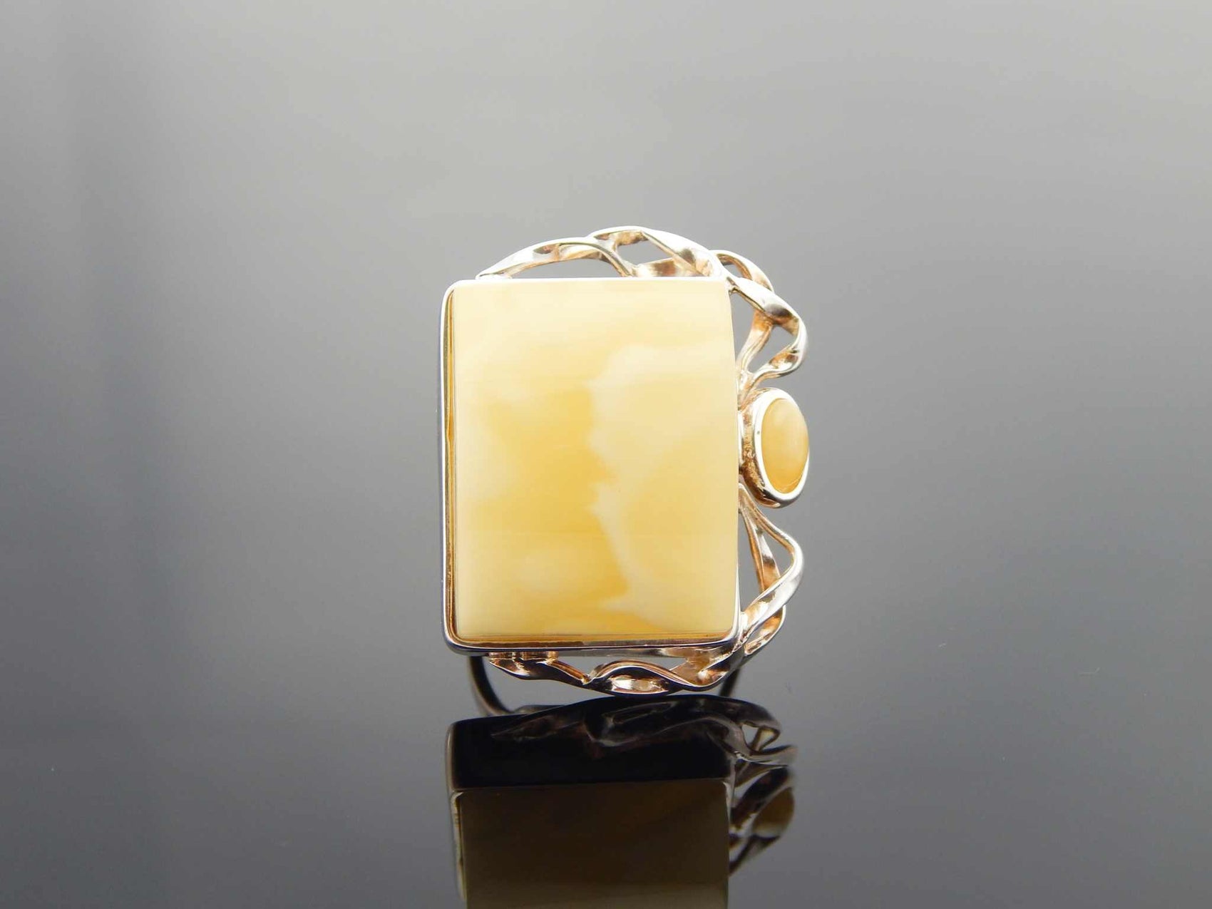 Natural Baltic butterscotch amber ring in 925 sterling silver, handmade avant garde design.