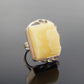 Natural Baltic butterscotch amber ring in 925 sterling silver with avant garde design.