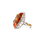 Natural Baltic cognac amber grape leaf statement ring in 925 sterling silver with oval cut stone, adjustable size.