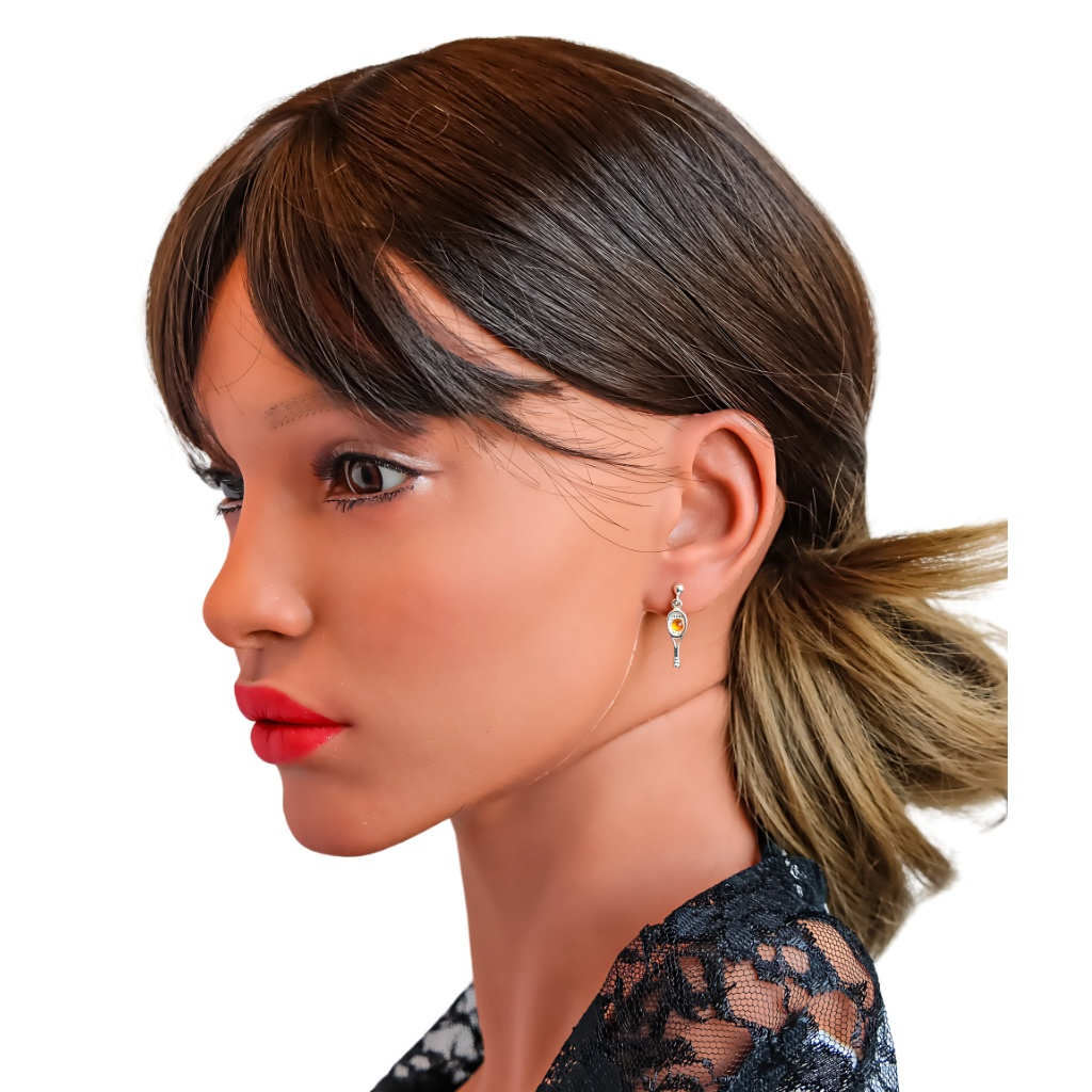 Natural Baltic cognac amber tennis racket earrings on model.