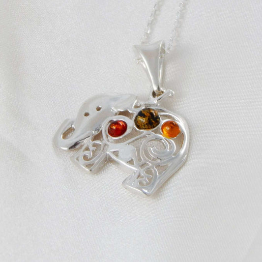 Natural Baltic multicolor amber elephant pendant necklace with sterling silver chain.