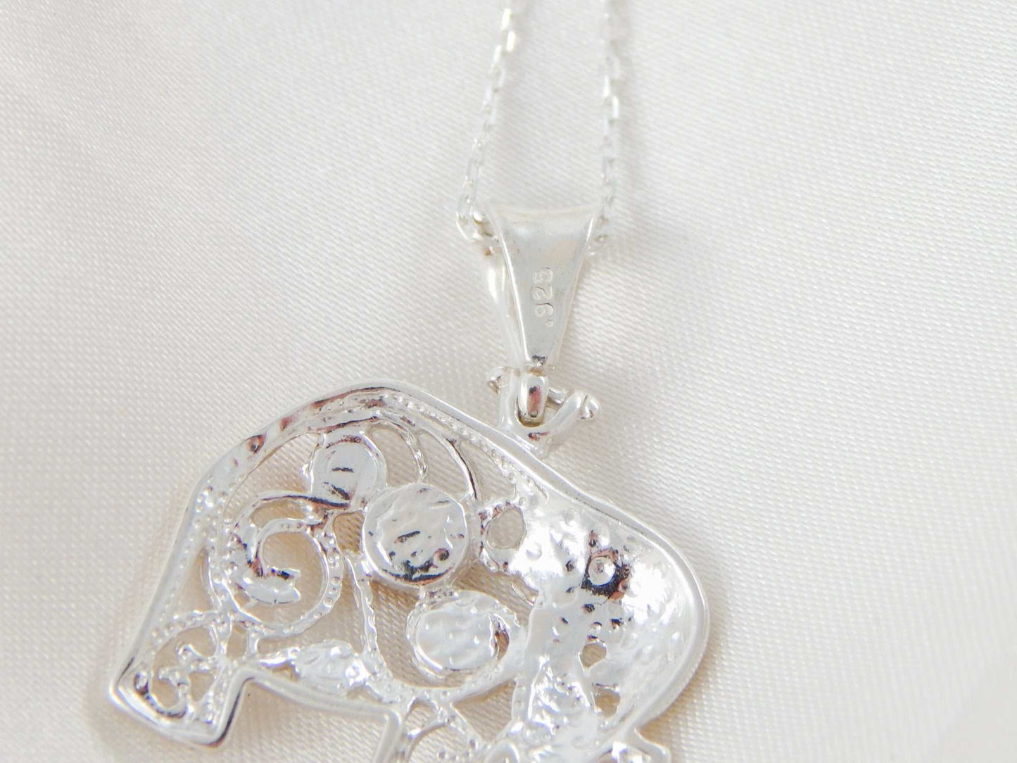 Natural Baltic multicolor amber elephant pendant necklace with sterling silver chain.