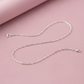 plain sterling silver cable chain on pinkish background