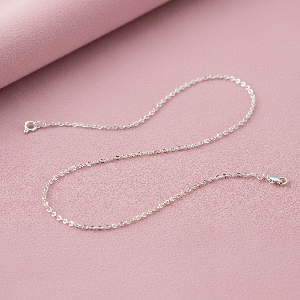 plain sterling silver cable chain on pinkish background