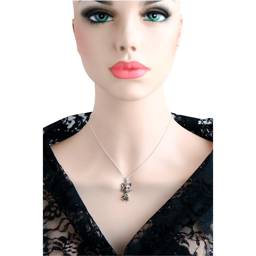 Sterling Silver Cat Pendant with Amber Eyes on mannequin, featuring 925 silver and Baltic amber on a 16-inch chain. Elegant feline necklace for women.