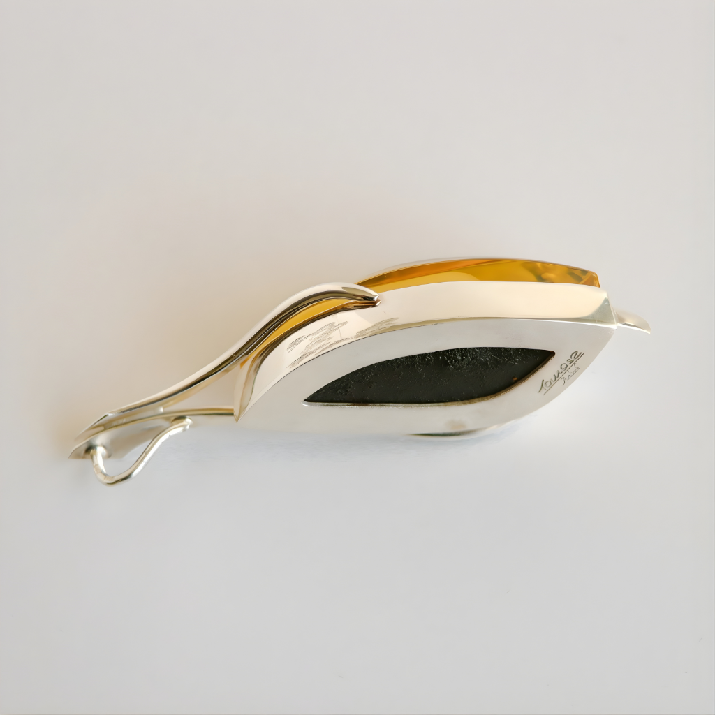 silver amber necklace on a light gray background