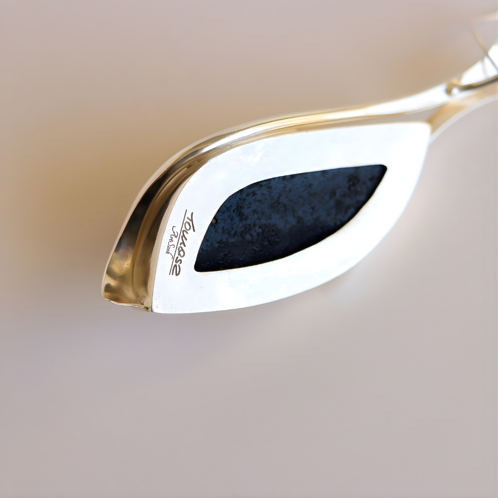 Close-up of a signature on amber necklace with a blurred background