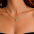 Model wearing turquoise necklace close up with red hair