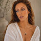 amber bee necklace on model on neutral background