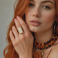 model wearing gold amber ring with close up