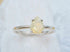 Opal Pear Cut Ring - Silver featuring a 10x8mm genuine opal gemstone in a 925 silver prong setting with a slim 2mm band.
