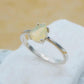 Elegant Opal Pear Cut Ring - Silver with semi-precious opal gemstone in a classic prong setting, perfect for everyday wear or gifting.