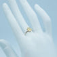 Genuine Opal Pear Cut Ring in 925 Silver displayed on a mannequin hand, highlighting its delicate design and shimmering gemstone.