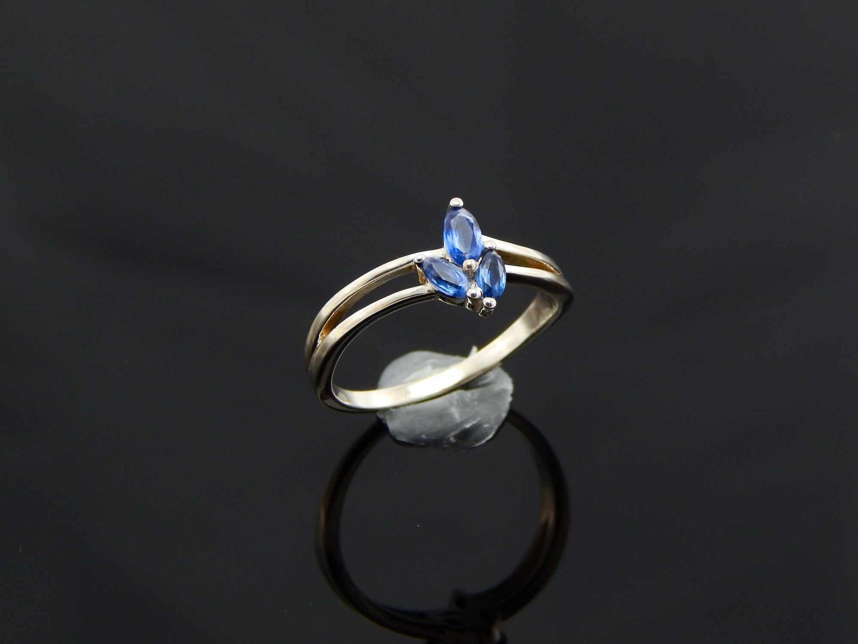 Genuine Kyanite Flower Ring in 925 Sterling Silver with marquise cut gemstones and split band.