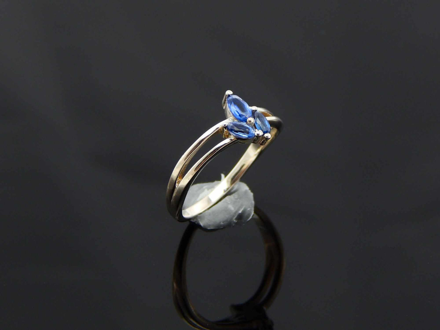 Genuine Kyanite Flower Ring in 925 Sterling Silver with marquise cut gemstones and split band design.
